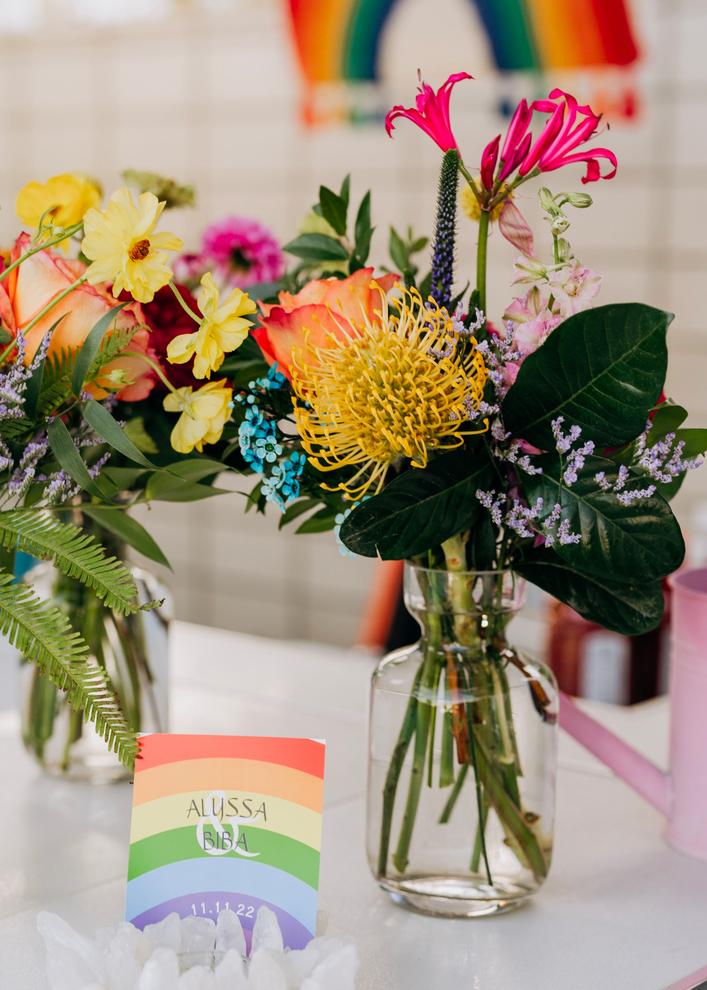 Rainbow floral arrangement at a rainbow themed wedding